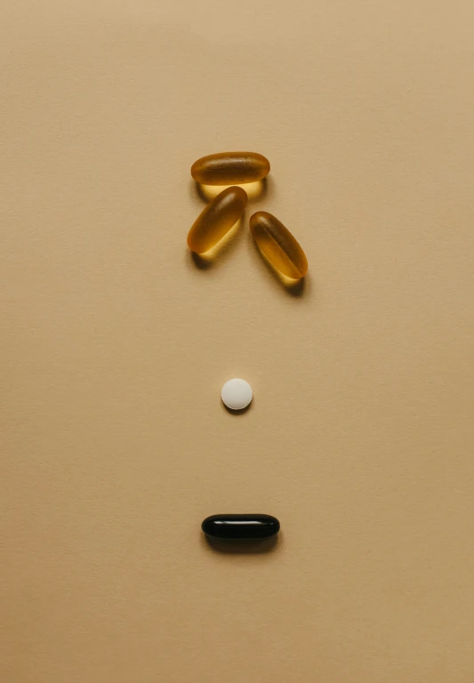 pills are placed on top of the two faces of a person