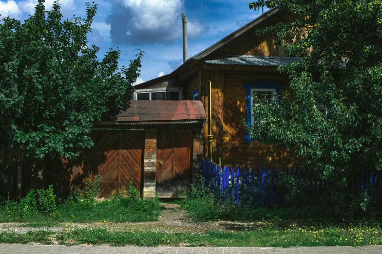 the small building is in the corner of the lot