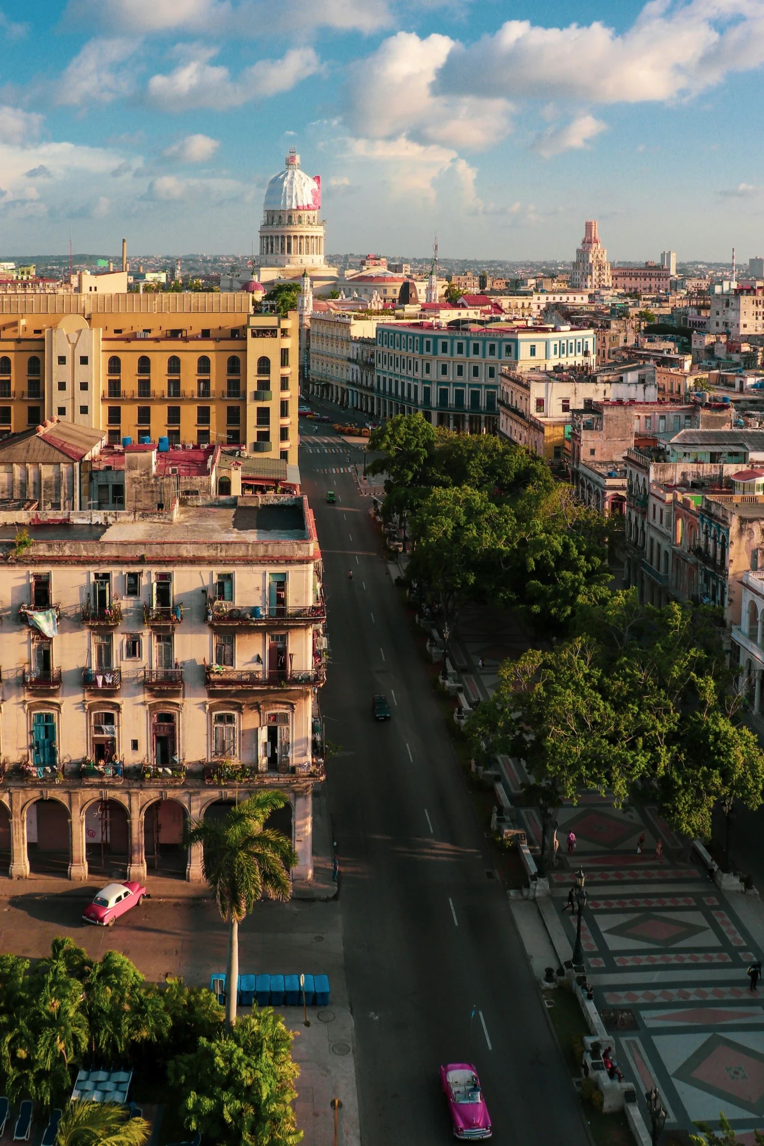 a small, three - story building stands above the streets of a large city