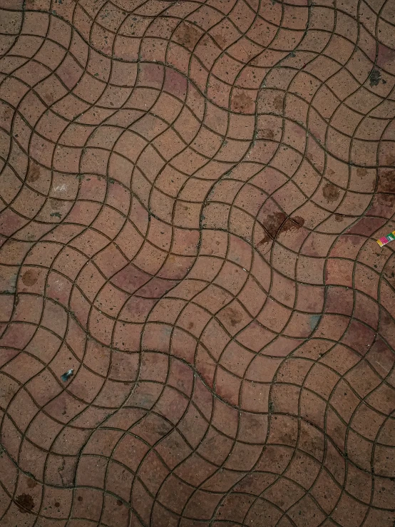 a woman in tight boots walking through a tiled area