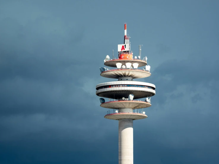 a tall tower with two small towers on it