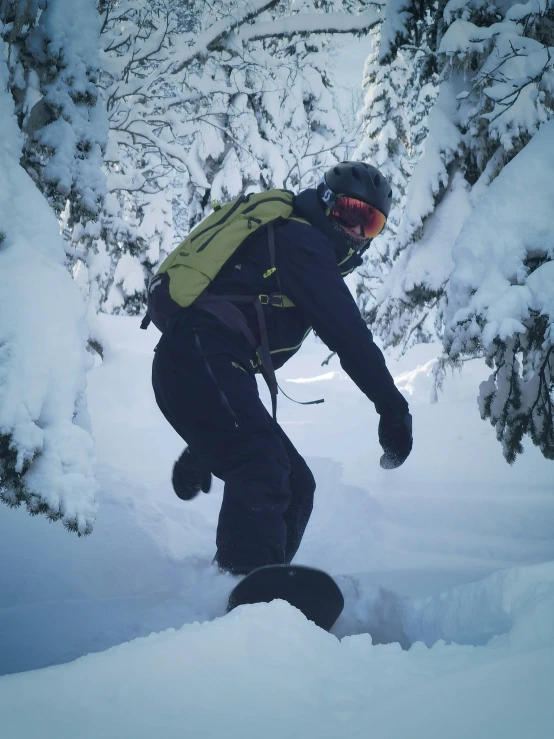 a man riding a snowboard through the snow