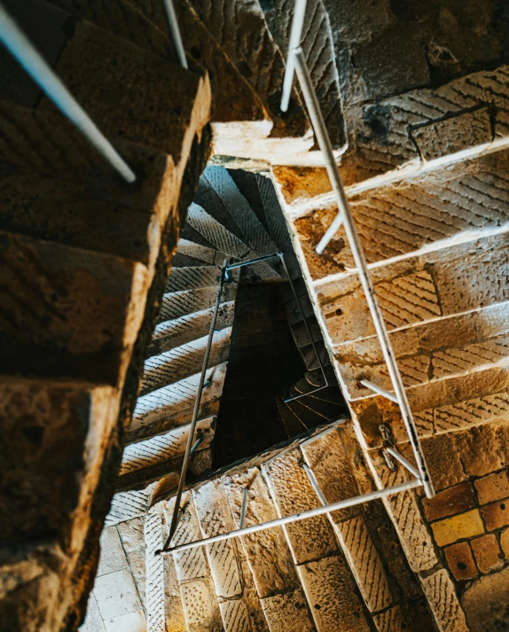 stairs leading up to a dark room with cement flooring