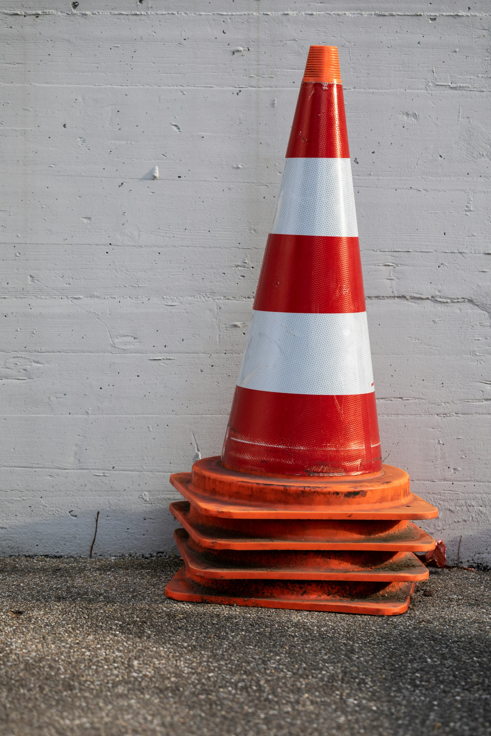 a close up of a red white and gray cone