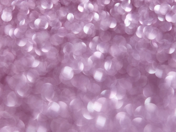 blurry image of small pink bubbles and confetti