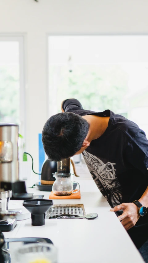 an image of a woman making some kind of drink