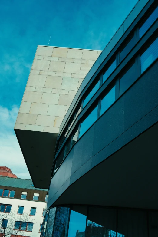 a tall building sitting next to a glass window