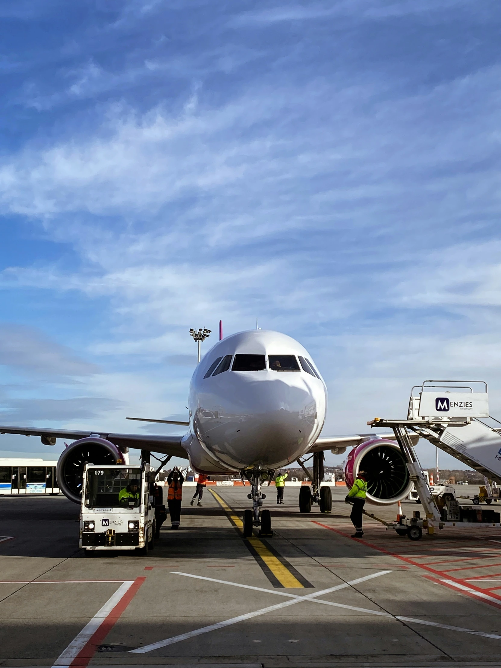 the front end of an airplane with a crew boarding