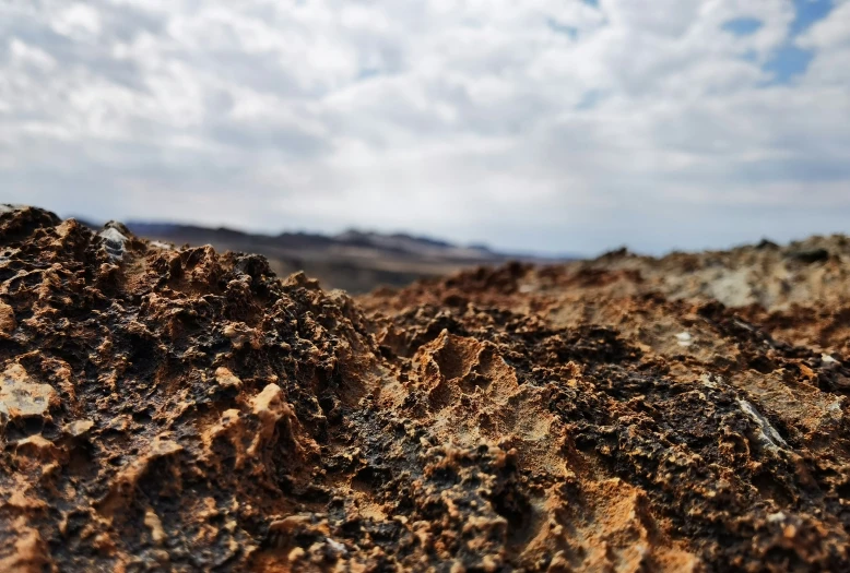 a rock outcropping and some clouds in the background