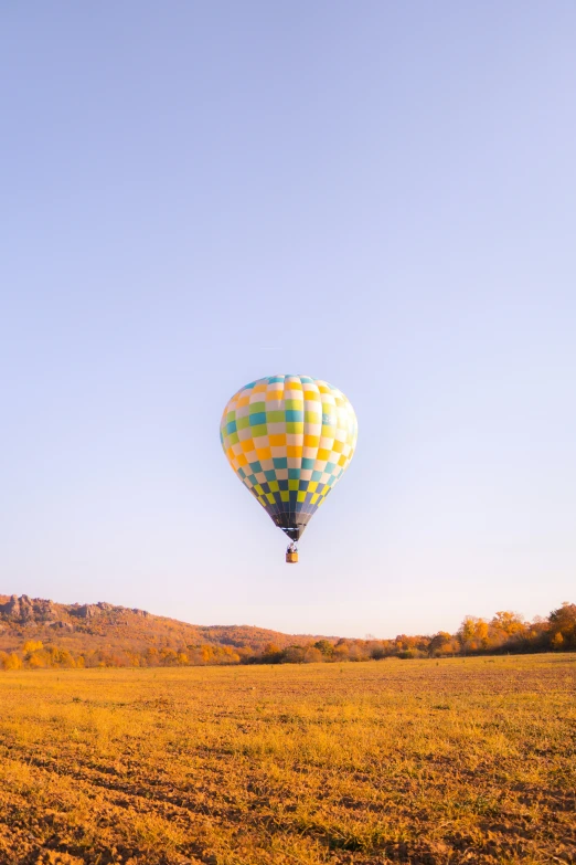 the  air balloon in the sky is being launched