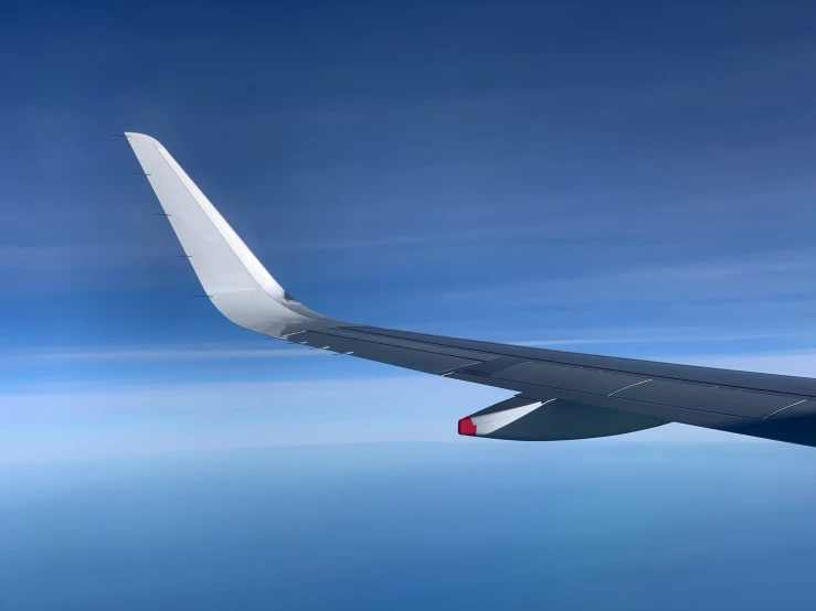 a view from inside an airplane wing over the ocean