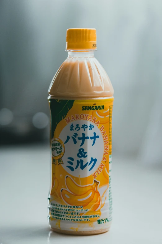 orange beverage sitting on top of a table