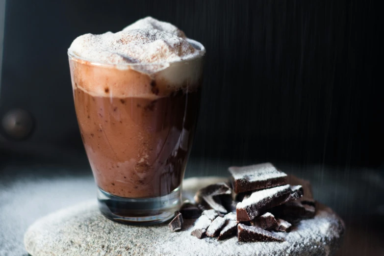 a table with chocolate desserts and a drink