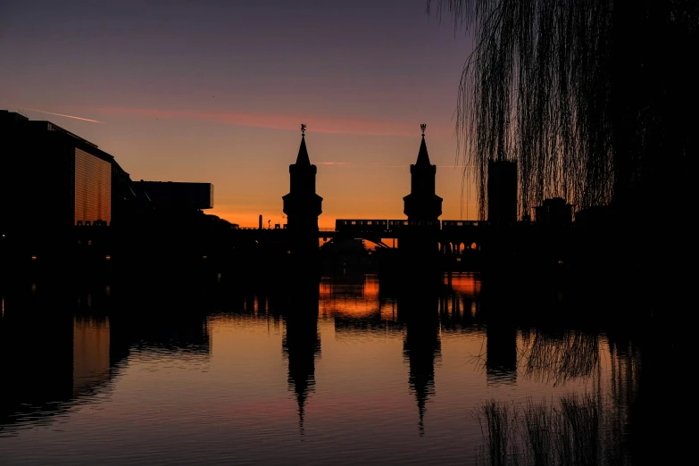 the view of some tall buildings from across the water