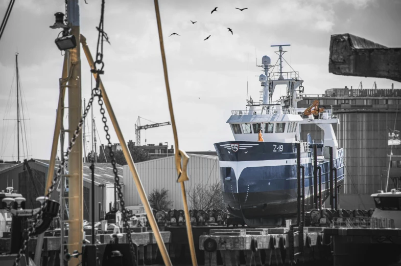 large ship is being unloaded in the port