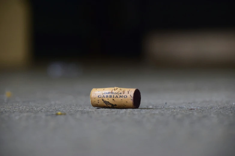 a cork laying across a carpet on top of a floor