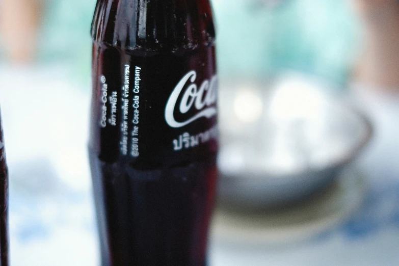 a closeup of a close up s of a coke bottle