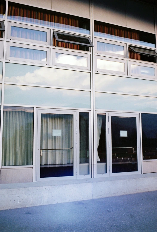 a building with two windows with different shades