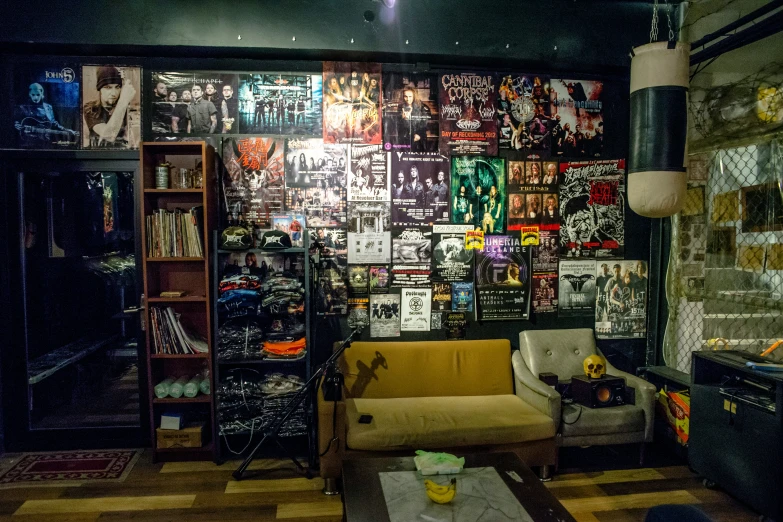 a room with many different posters on the wall