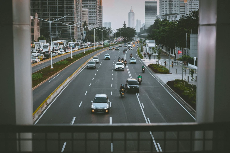 the city street is very busy with cars in it