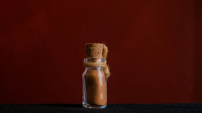 a bottle that has some sand in it