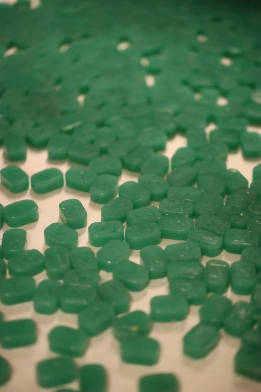 closeup po of pieces of green gummy