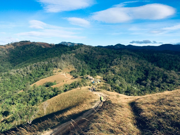 a group of people hiking up the side of a mountain