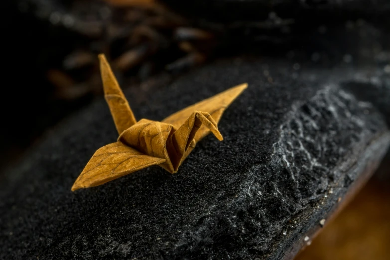 origami origami is on a wooden table