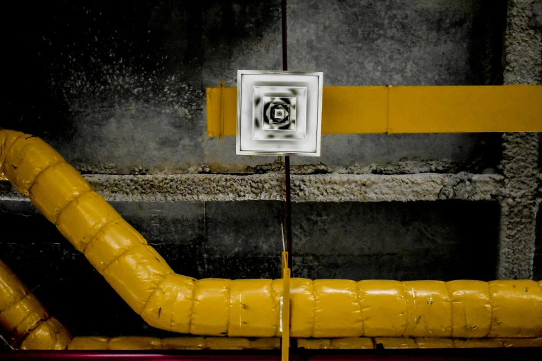 yellow pipes are connected to a duct hoses