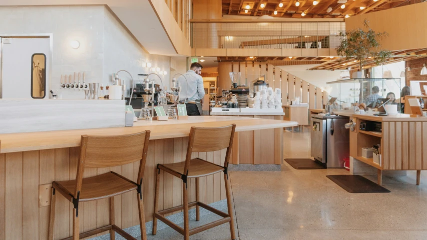 a bar with a row of chairs and a counter