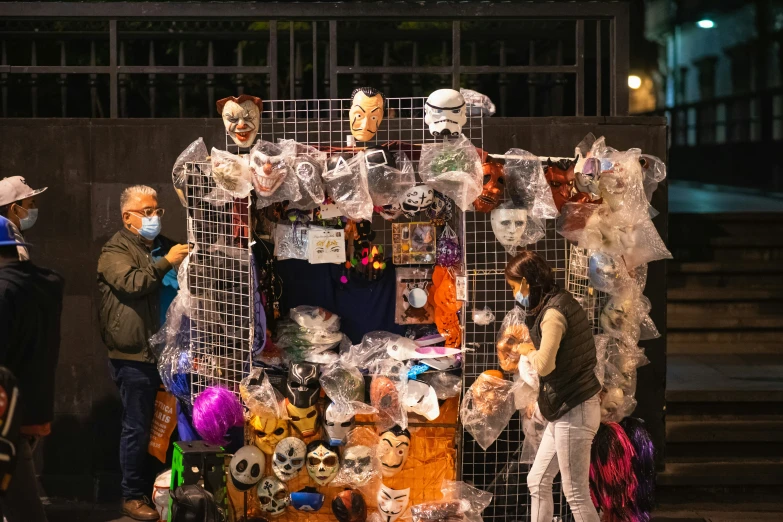 people wearing masks at a carnival and street