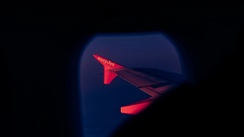 an airplane wing and it's left side light