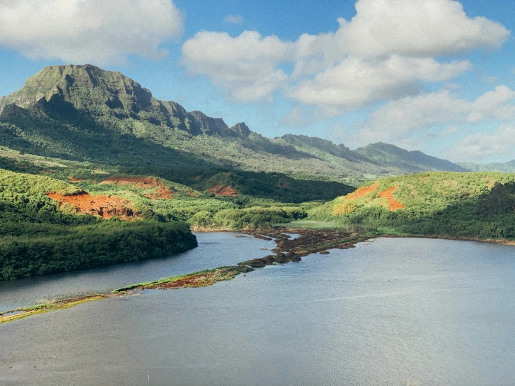 a scenic view of some mountains near a lake