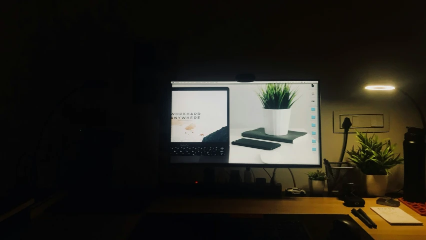 a desktop with a laptop sitting on it
