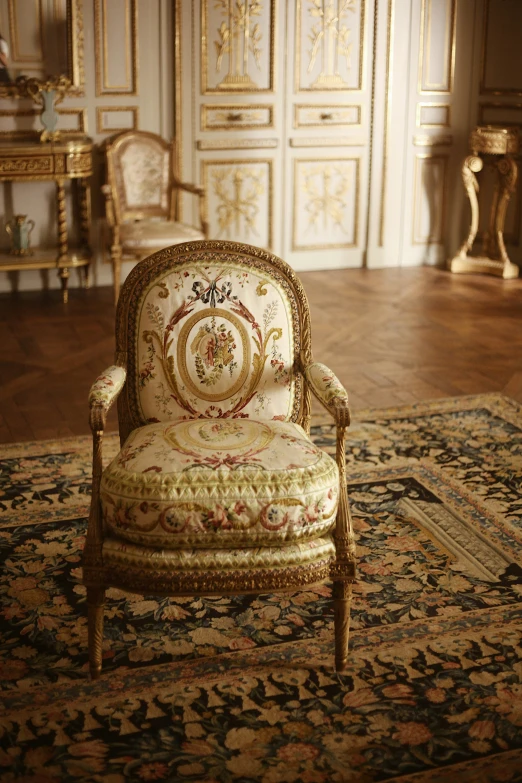 an antique style chair sitting on a rug