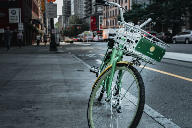 an old bicycle is sitting on the curb