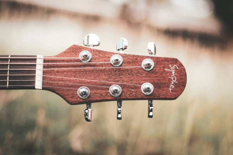 an electric guitar that is showing the heads