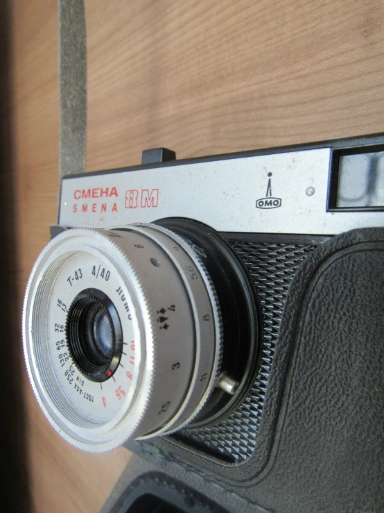 a silver camera and an old camera