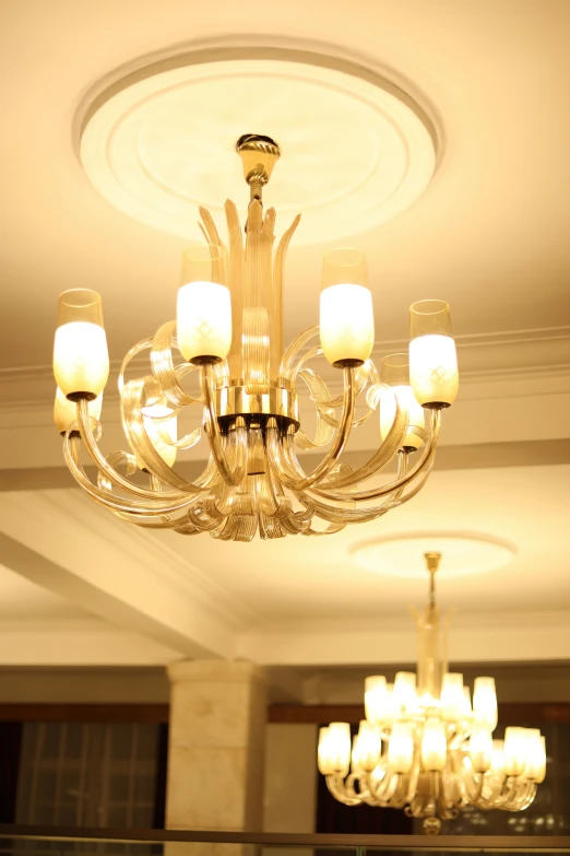 a chandelier hanging from the ceiling in a room