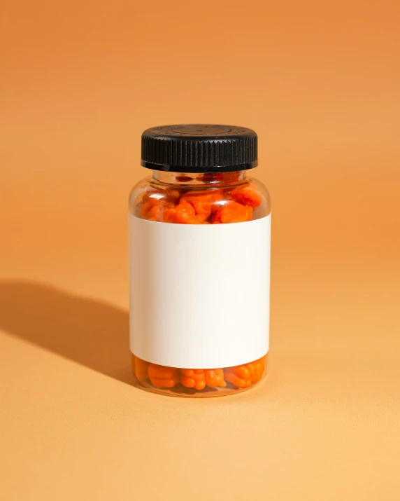 a jar of candies in the corner on top of a table