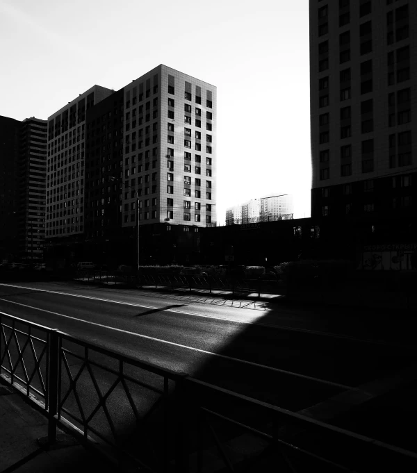 the black and white image is of an empty street