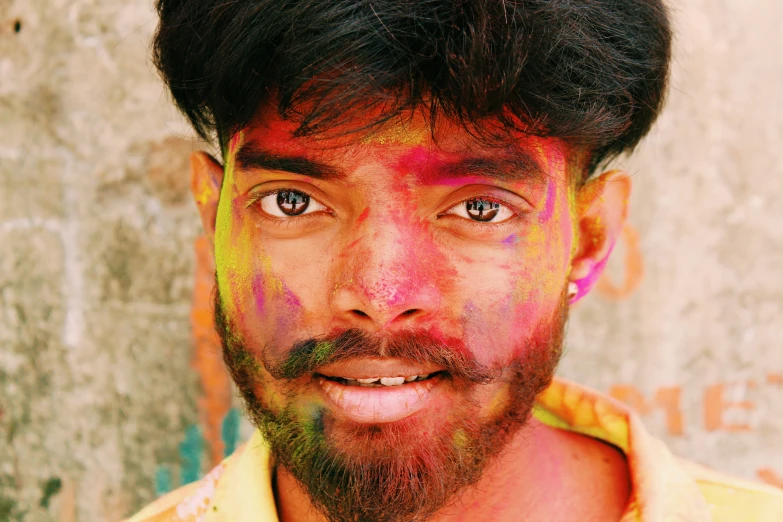 the man has colored painted on his face