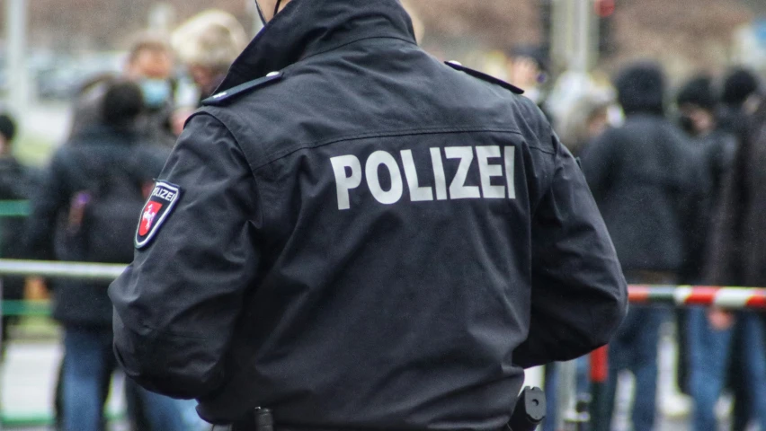 a police officer is standing outside on the street