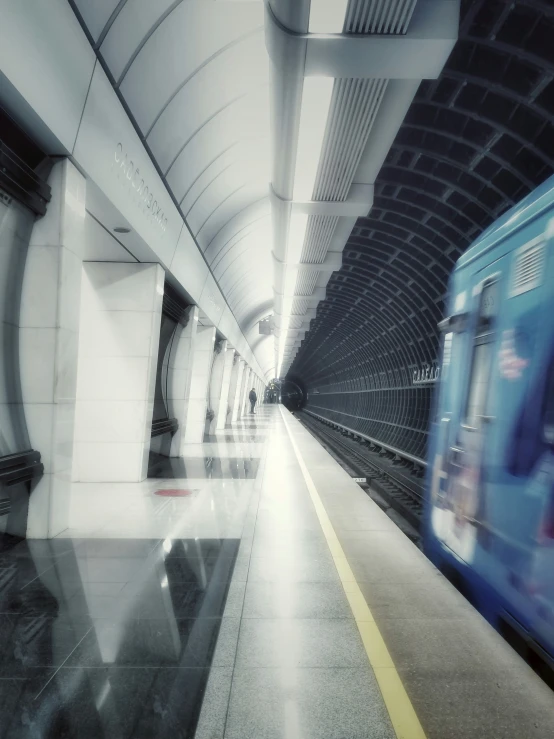 a blurry train is moving by in the tunnel