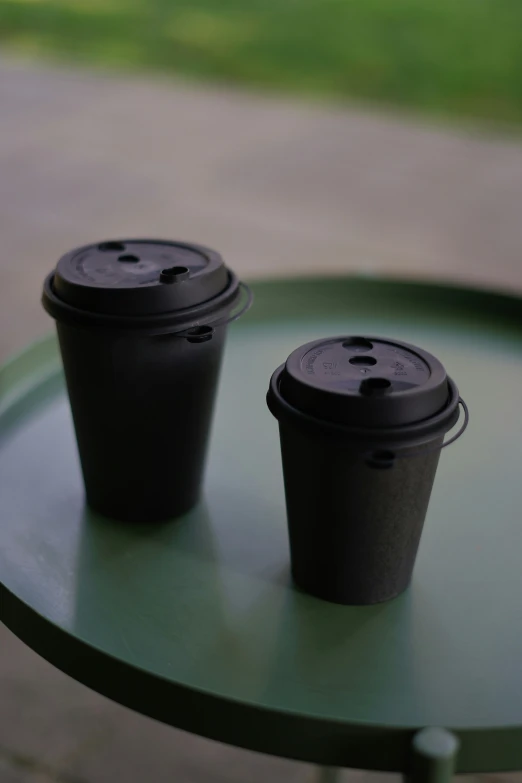 two empty coffee cups are on the round table