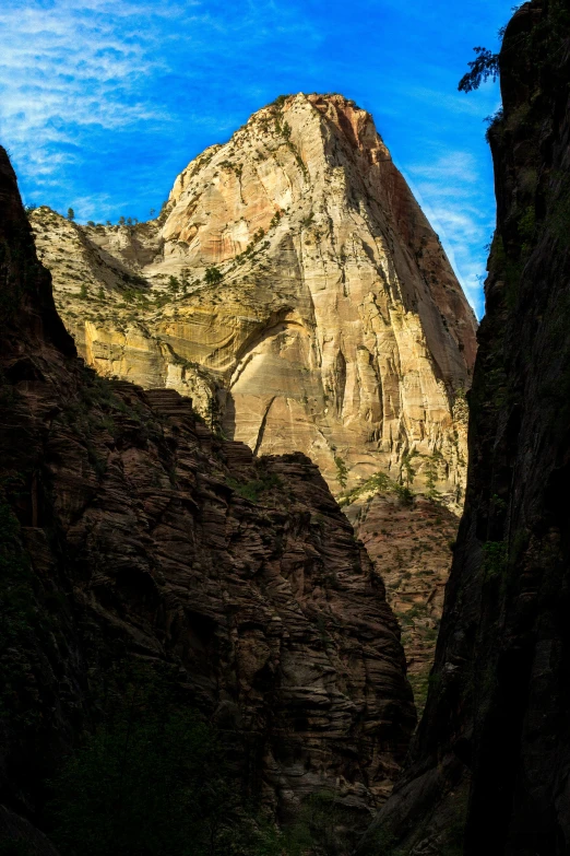 there is some mountain side rock formations near the mountains