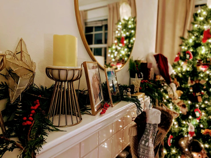 a christmas mantle has holiday decorations on it