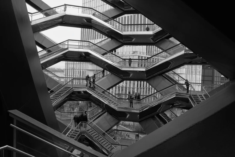 an interior staircase in the shape of a modern building