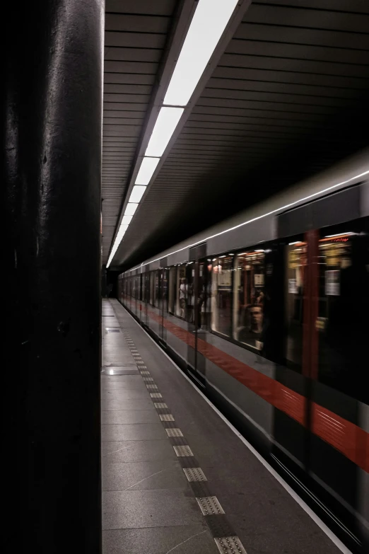 the subway train is going through the tunnel