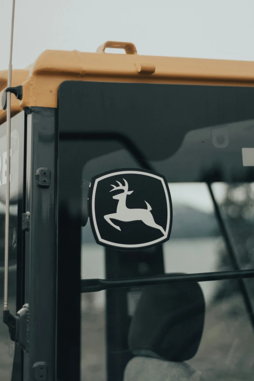 the deer emblem is on a large truck